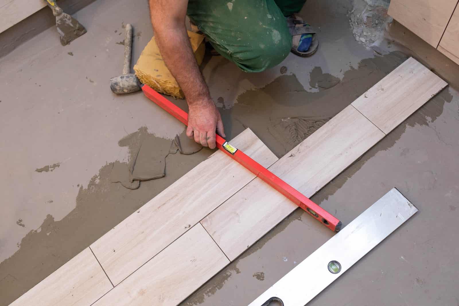man doing diy tiling