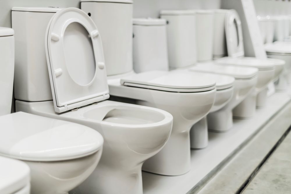 bathroom fixtures row of toilets