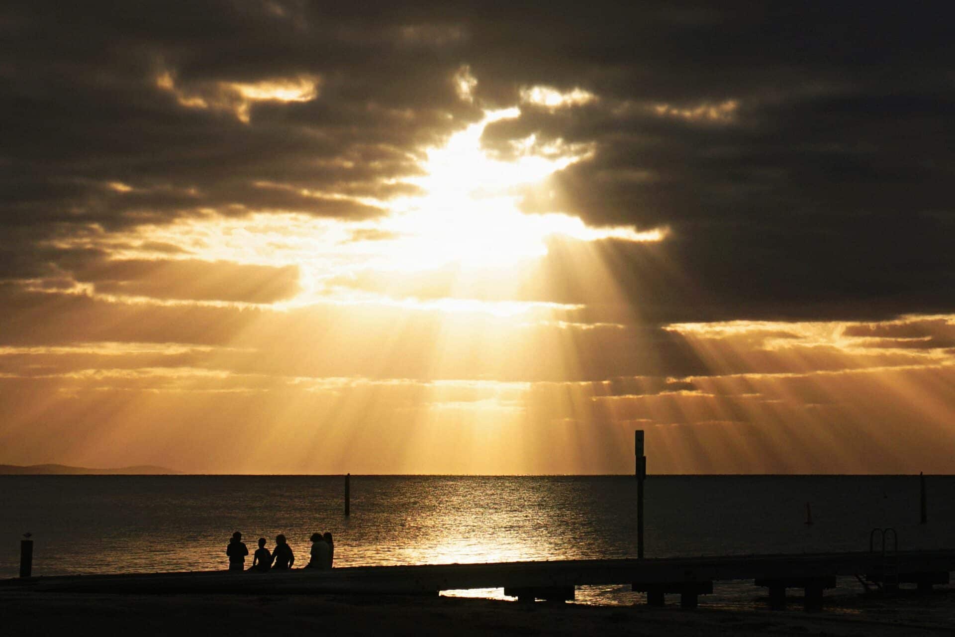 A family in silhouette at Busselton Foreshore.